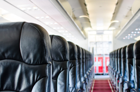 Airplane Seat View Interior. Black Cover with Red Carpet.の写真素材
