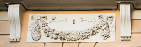 Number one on a facade with flower stone decorationの写真素材