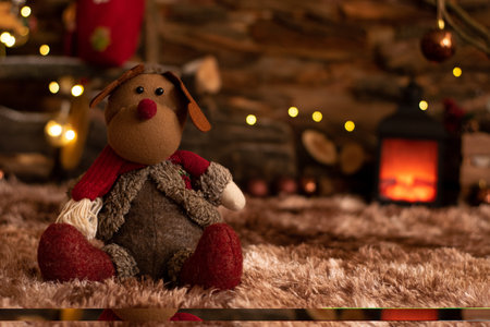 Christmas reindeer plush sitting in a Christmas atmosphereの写真素材