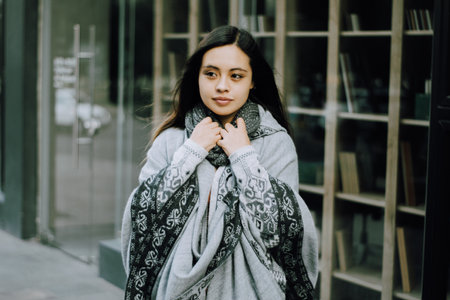 <p>Girl with a satisfied look standing in the city. happy girl in the city</p>の写真素材