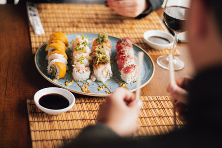 Sushi plate on the table of a luxurious restaurant. Sushi dish accompanied by soy sauce ready to eat.の写真素材
