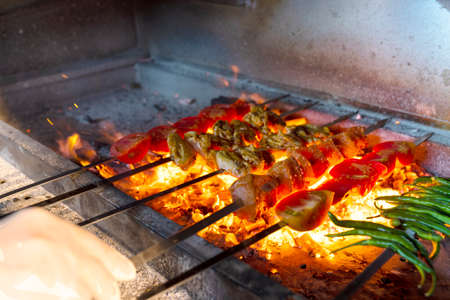 grill of meat and vegetables with hot coalsの写真素材