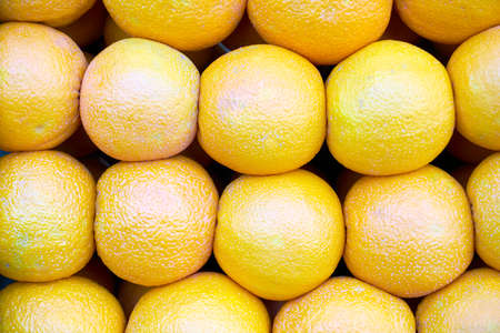 group of mandarin oranges lined up for backgroundの写真素材