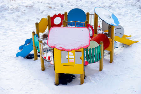 snowy playground in winter without children to play in the coldの写真素材