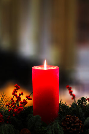 lit red candle for christmas decoration at homeの写真素材