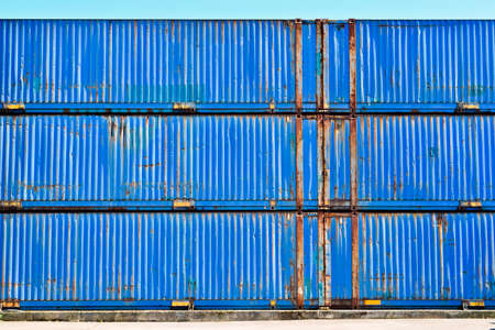 Old rusty blue containers standing unusedの写真素材