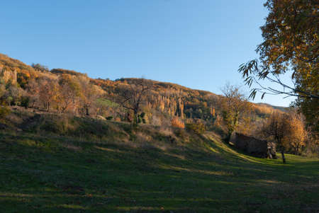 Stone field shed for logging in autumn landscape in Valle del Ambrozの写真素材