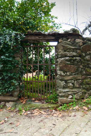 Wrought iron gate in slate wall in Robledillo de Gataの写真素材