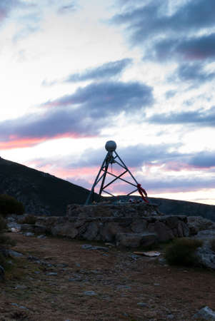 Metallic structure with bell in a mountain area at sunset, Port of Hondurasの写真素材
