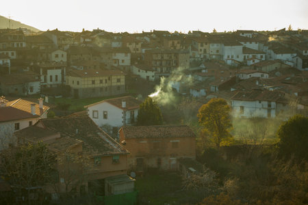 View at sunset with smoking chimneys of the Jewish neighborhood of Hervas in Caceres horizontalの写真素材