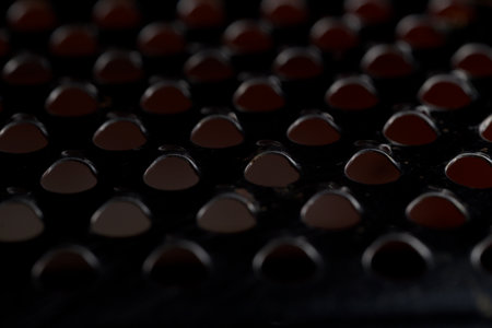 Moody abstract metallic background with soft reflections and defocused rounded shapes creating a modern minimal texture ideal for design and creative projectsの写真素材