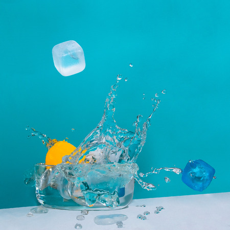 geometric shapes splashing water in a containerの写真素材