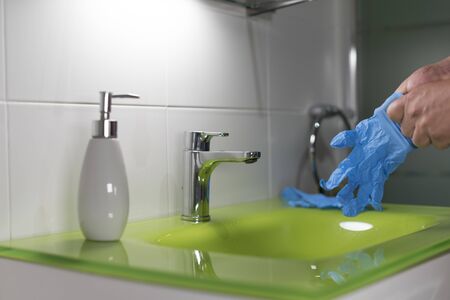 person putting mittens after washing handsの写真素材