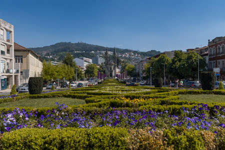 view of gardens with cathedral in the background at the entrance of the walled city.のeditorial素材