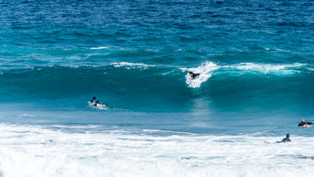 surfing on the beach of la cicer in Las Plamas de Gran Canaria