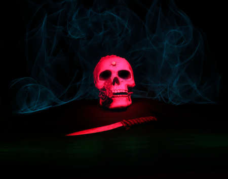 Halloween motif, composed of a skull and a dagger, in a light environment, with the technique of painting with lightの写真素材