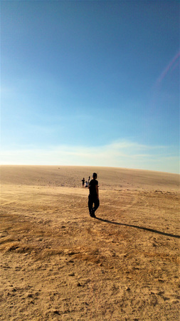 A man walking in the desertの写真素材