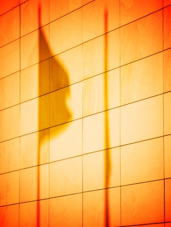 Shadow of flag on the facade of a building の写真素材