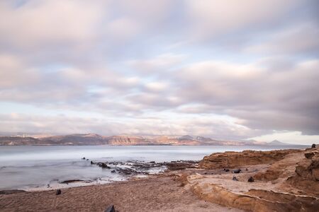 El confital beach at sunrise in Gran Canaria, Canary islands, Spain. Coast volcanic landscape.の写真素材