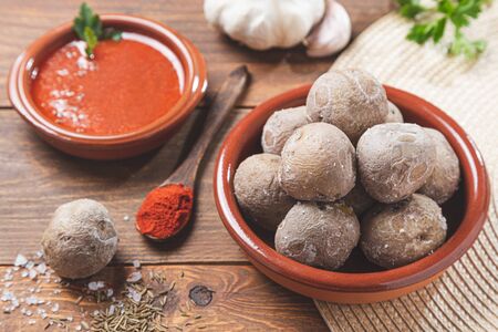 Crumbled potatoes with mojo . Typical canarian dish, potatoes with mojo pic?n. Typical Spanish and Canarian tapas concept.の写真素材