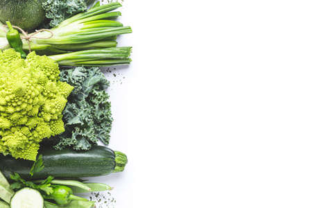 Variety of green vegetables on white background with copy space. Top view.の写真素材