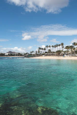Sunny beach in Costa Teguise, Lanzarote, Canary Islands, Spain.