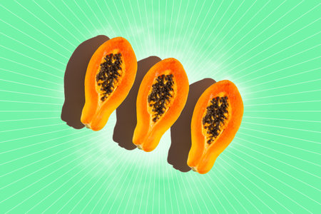 Three slices of papaya on green background. Top view.の写真素材