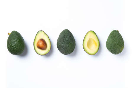 Fresh avocados pieces set Isolated on white background. Top view.の写真素材