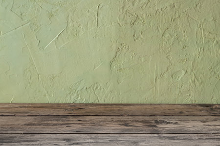 Green texture and wood background.