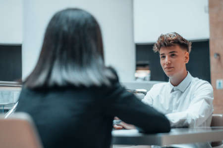 Hardworking manager chatting as a team with her client in her office in a sit-down meetingの写真素材
