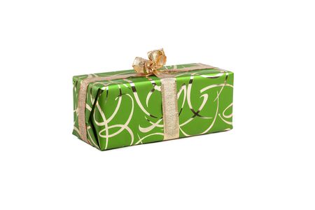 packaged rectangular gift in green packaging with gold bow and gold pattern on a white backgroundの写真素材