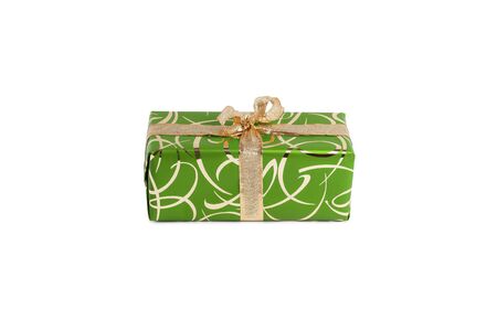 packaged rectangular gift in green packaging with gold bow and gold pattern on a white backgroundの写真素材