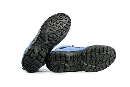 mens winter boots blue for expeditions of travel isolated on a white backgroundの写真素材
