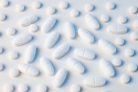 white pills on white background with blue lightsの写真素材