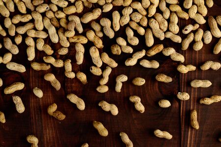 Peanuts on a dark background. Peanuts in the shell. Healthy food.の写真素材