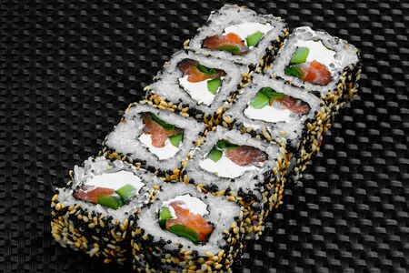 Japanese rolls on a dark textured backgroundの写真素材