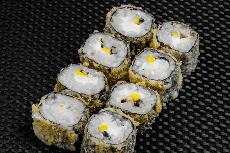Japanese rolls on a dark textured backgroundの写真素材