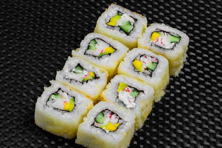 Japanese rolls on a dark textured backgroundの写真素材