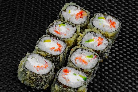 Japanese rolls on a dark textured backgroundの写真素材