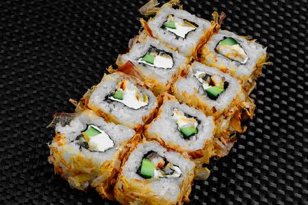 Japanese rolls on a dark textured backgroundの写真素材