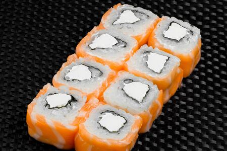 Japanese rolls on a dark textured backgroundの写真素材
