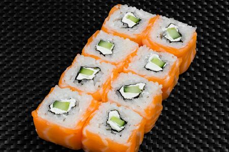 Japanese rolls on a dark textured backgroundの写真素材