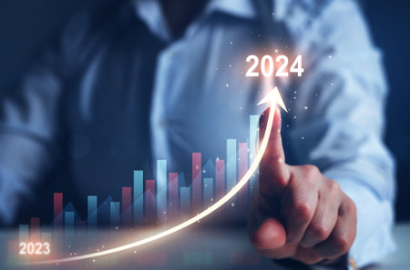 Businessman draws increase arrow graph corporate future growth year 2023 to 2024. New Goals, Plans and Visions for Next Year 2024.Planning,opportunity, challenge and business stratの写真素材