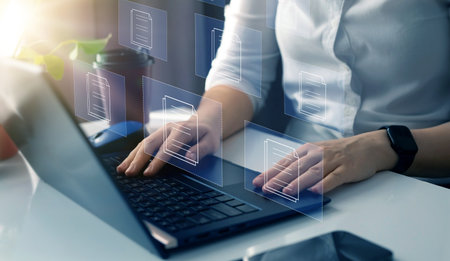 Woman working with laptop computer in office. Internet and technology concept.