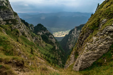 A mountain view from Bucegi Mountains over the Busteni Cityの写真素材