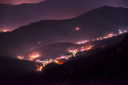 Night view of a bright city near CeahlÄu Mountainsの写真素材