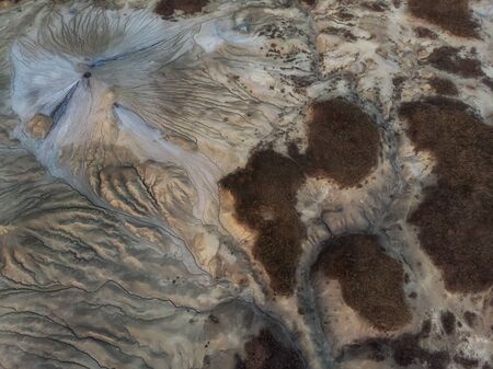 Beautiful aerial view of a lunar landscape  over the muddy volcanoes, Paclele, Berca, Buzau County,...