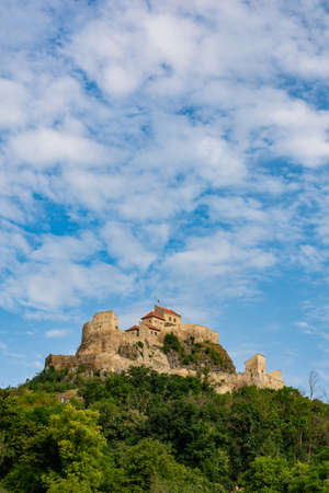 Beautiful view of the Rupea Stronghold Fortress on a blue sky with white clouds, Rupea, Brasov, Romaniaのeditorial素材