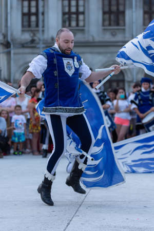 Bucharest, Romania - July 13, 2018 The flag wavers show of the Sbandieratori di Alba performers from Italy during the B-Fit International Street Theater Festival in the historic centerのeditorial素材