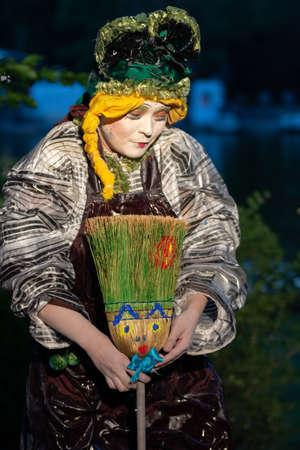 Bucharest, Romania - May 24,2018, Brooms seller, Living Statues, Street Theater Festival, Cismigiu Parkのeditorial素材